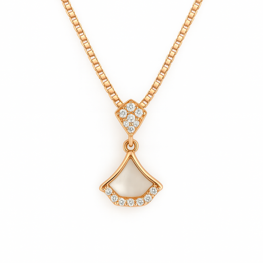 Gold necklace with a pendant on a white background