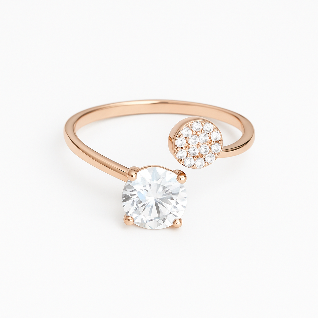 Rose gold ring with a large clear gemstone and smaller round gemstone on a white background