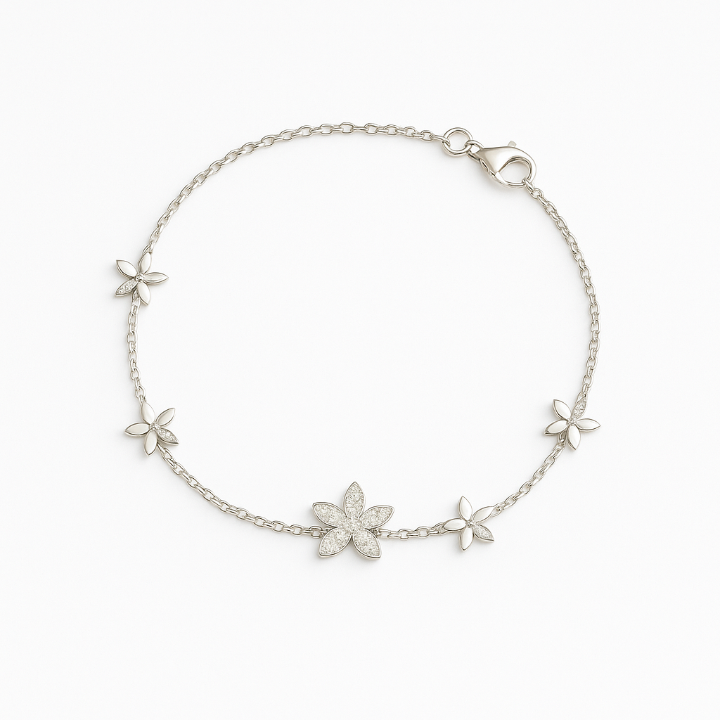 Silver bracelet with floral designs on a white background