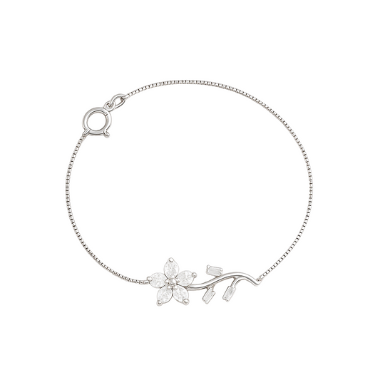 Silver bracelet with floral design on a white background