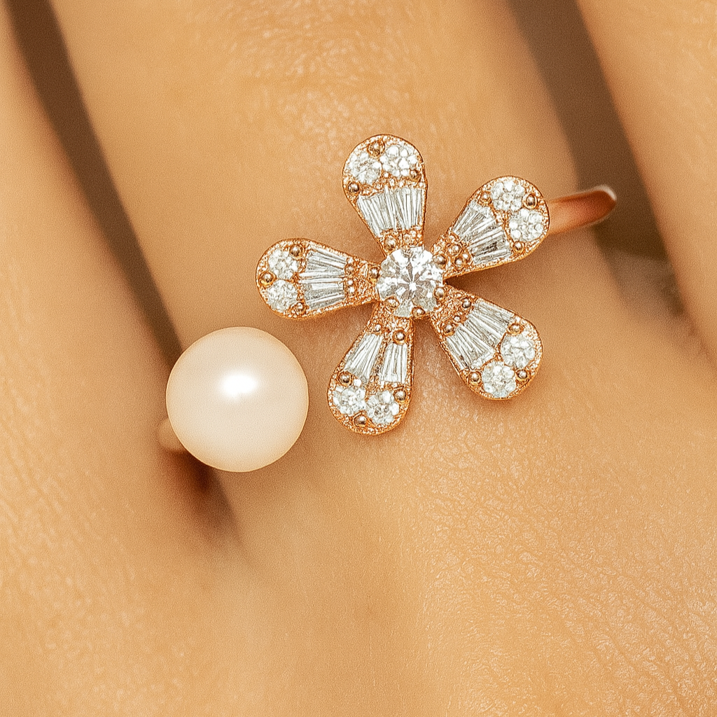 Close-up of a floral diamond earring and pearl stud on an ear.