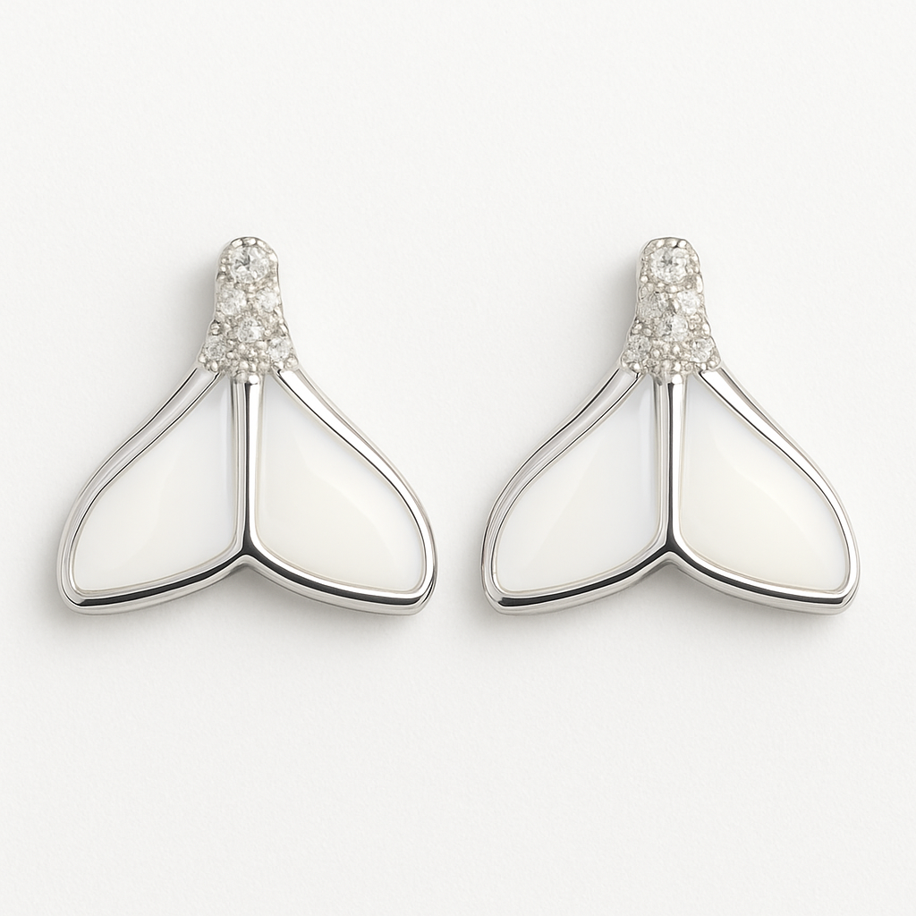 Pair of silver earrings with white stones on a light gray background