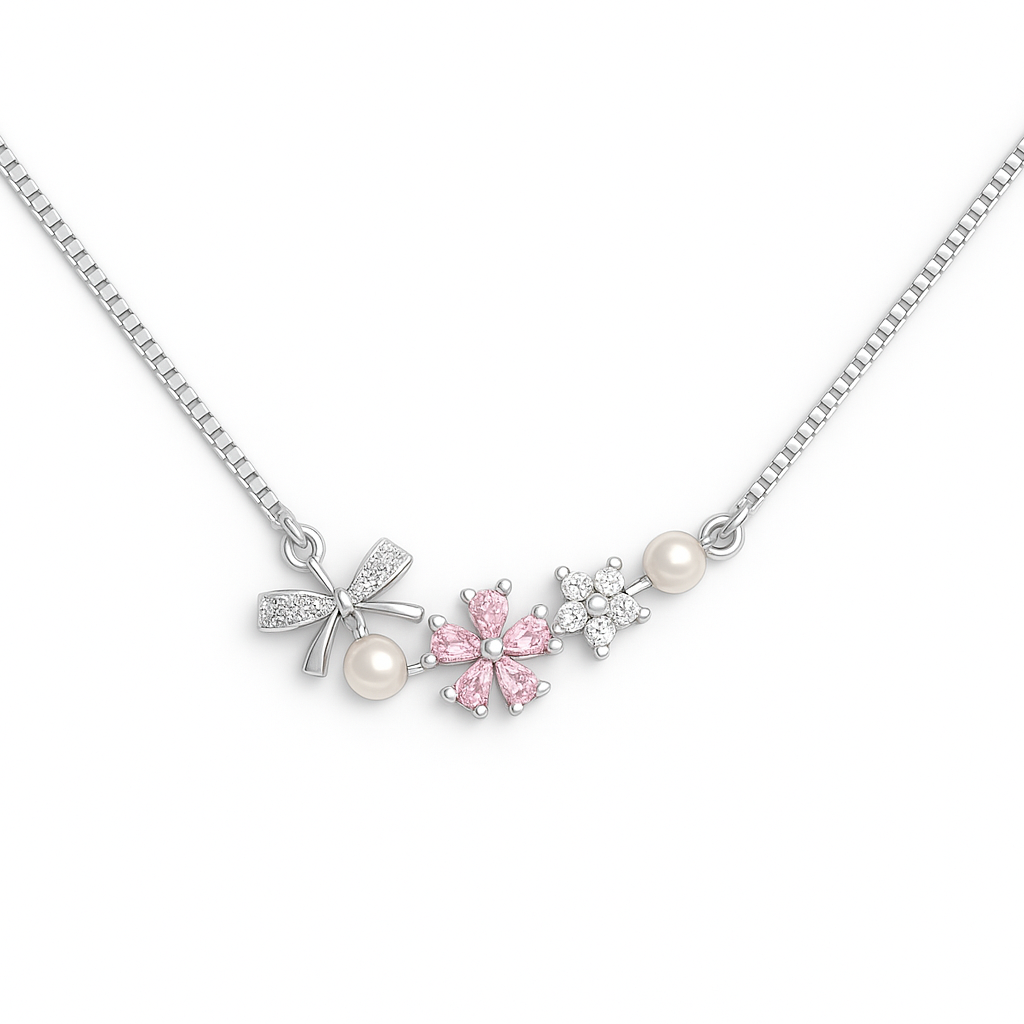 Necklace with floral and bow-shaped pendants on a white background