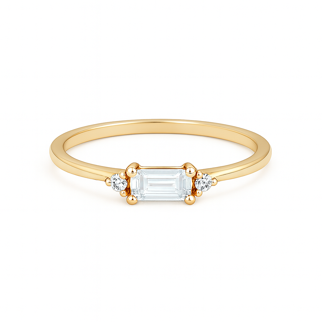 Gold ring with a rectangular diamond on a white background