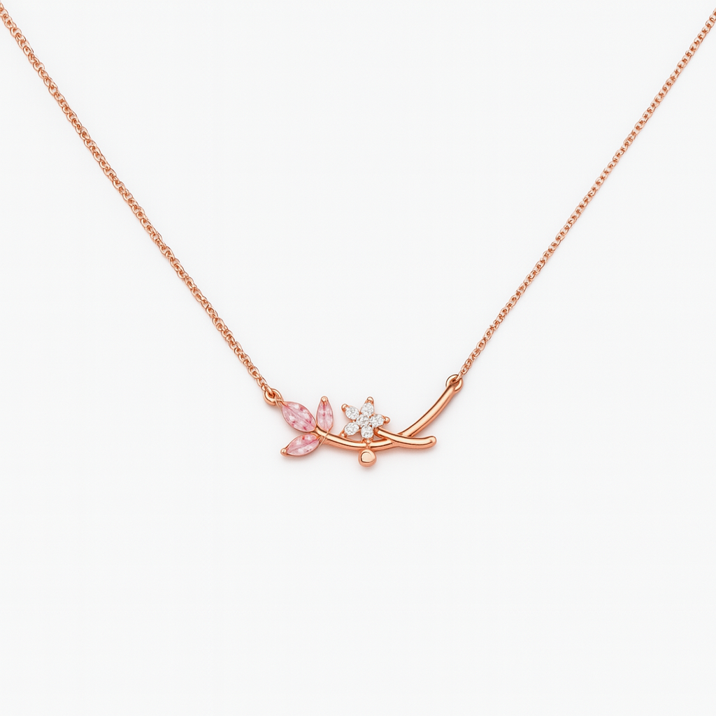 Rose gold necklace with floral pendant on a white background