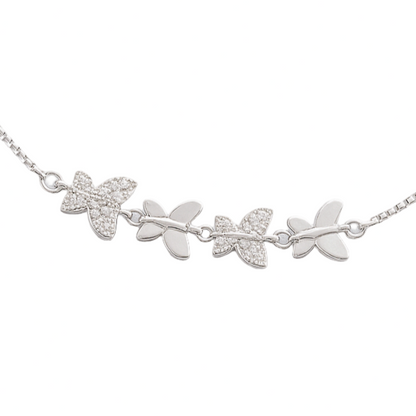 Silver bracelet with leaf designs on a white background