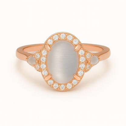 Rose gold ring with a central stone and diamond accents on a white background