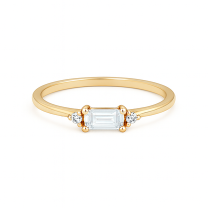 Gold ring with a rectangular diamond on a white background